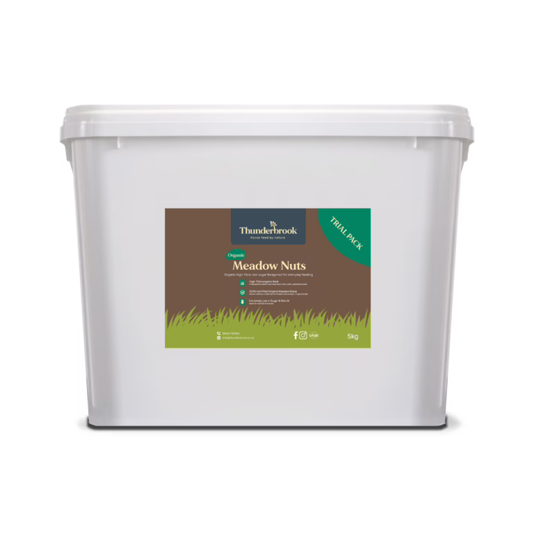 White plastic container with a brown-green label reading Thunderbrook Meadow Nuts; likely a 5kg product package for horse feed (tray includes logo).